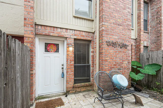a outdoor living space with patio furniture and potted plants