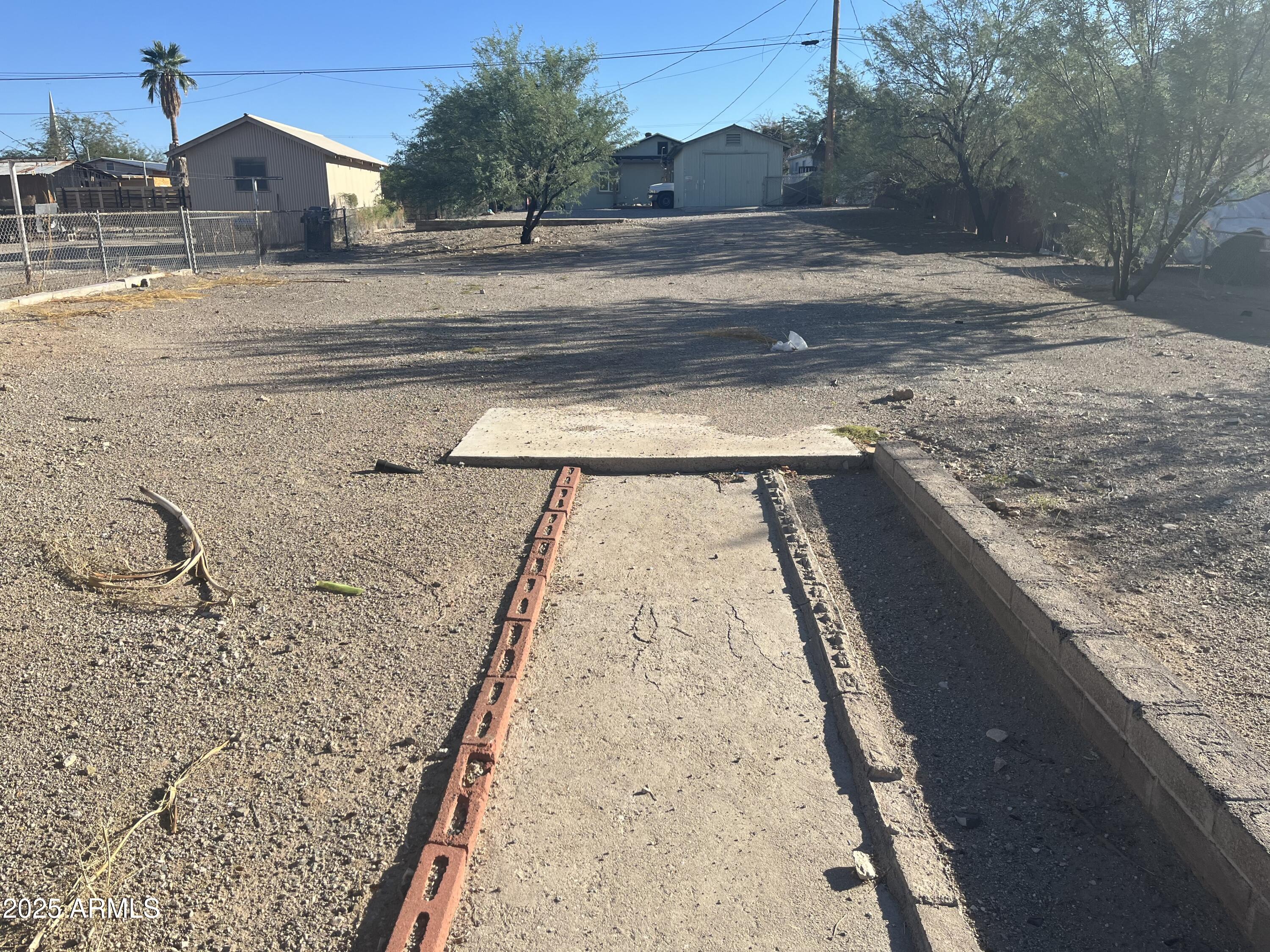 831 West Ocotillo Avenue, Unit 7 Ajo, AZ 85321 - Photo 2 of 4 a view of a backyard of a house