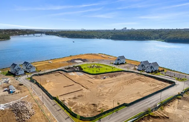 a view of a swimming pool and a yard