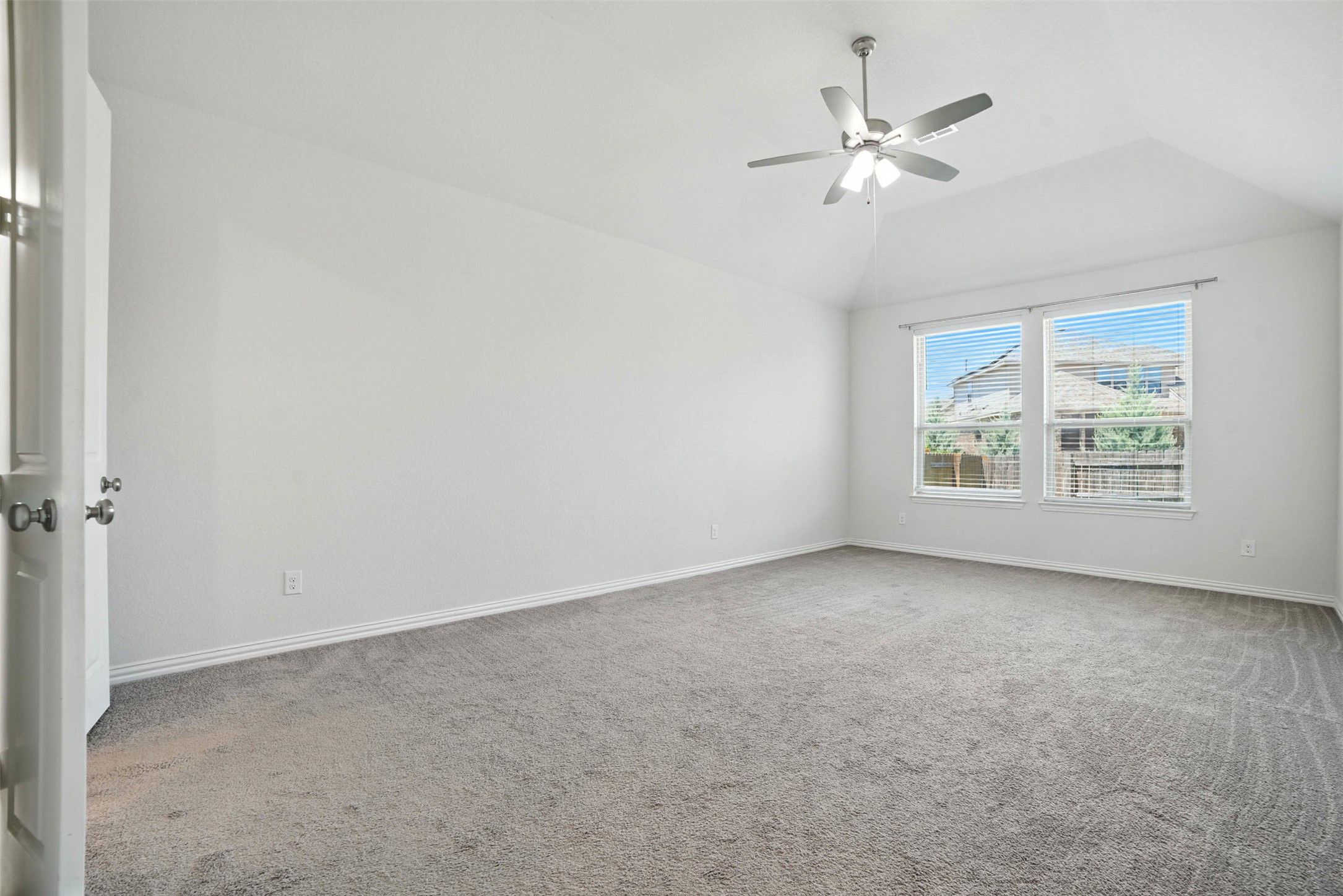 3054 Columbus Loop Round Rock, TX 78665 - Photo 16 of 40 Unfurnished room featuring carpet flooring, lofted ceiling, and ceiling fan