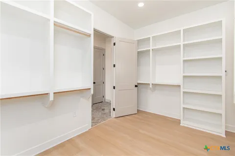 a view of an empty walk in closet