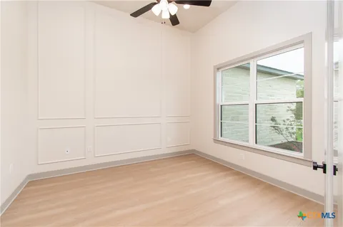 an empty room with a empty space and a window