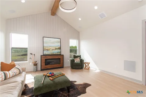 a bedroom with furniture and a fireplace