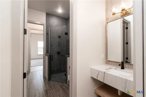a bathroom with a bathtub and a sink