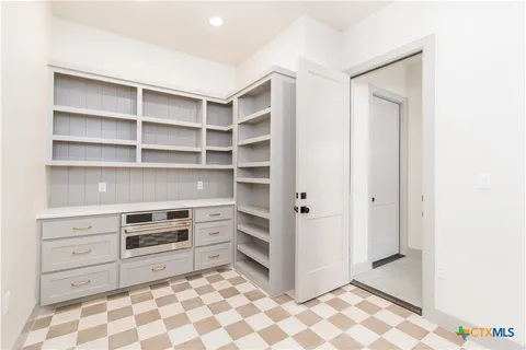 a room with a furniture and natural light