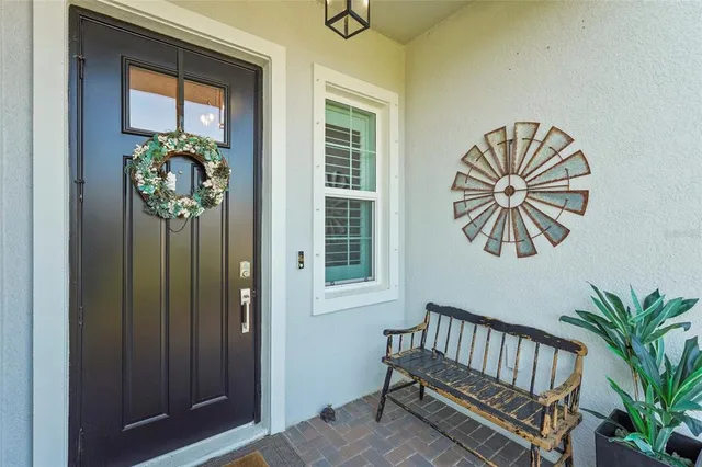 a kitchen with granite countertop a sink a stove and cabinets