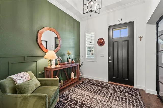 a kitchen with stainless steel appliances granite countertop a kitchen island hardwood floor and a sink