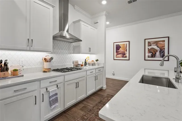 a living room with furniture a dining table and a chandelier