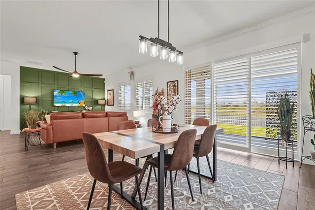 a bedroom with a bed and a potted plant