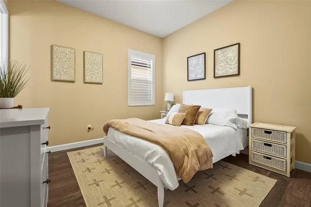 an aerial view of residential houses with outdoor space and ocean view