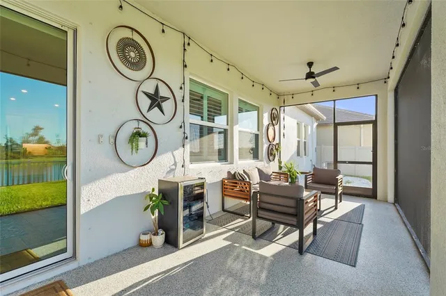 a view of a swimming pool with a garden and lake view