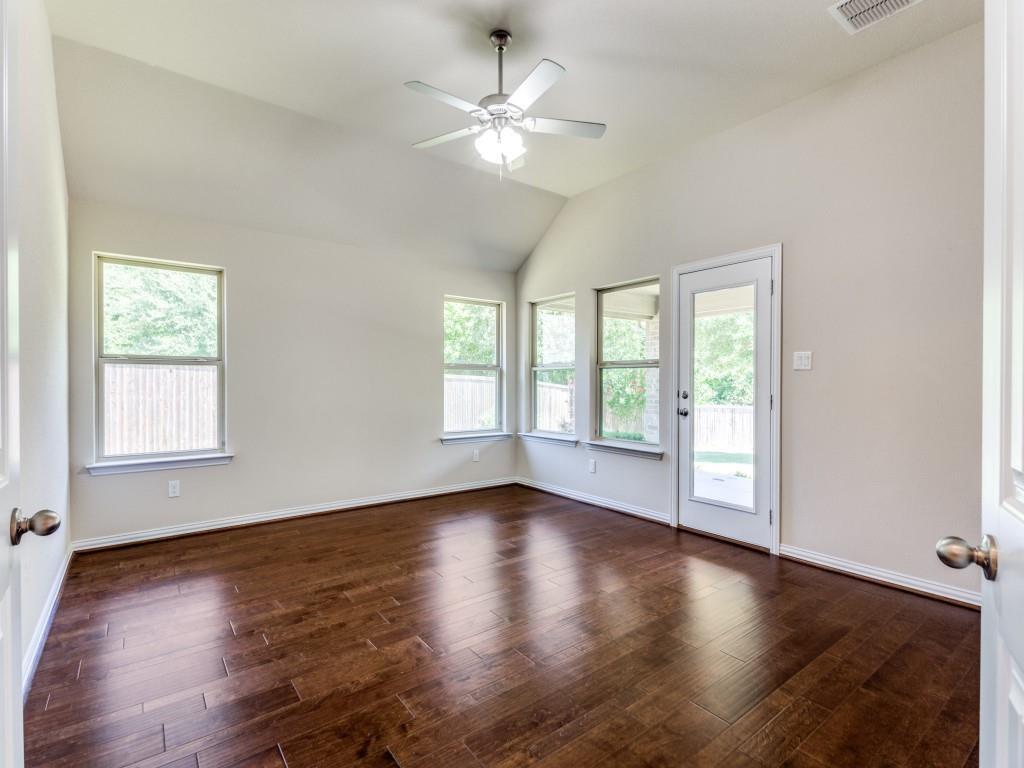 521 Corriente Trail Azle, TX 76020 - Photo 17 of 25 an empty room with wooden floor and windows