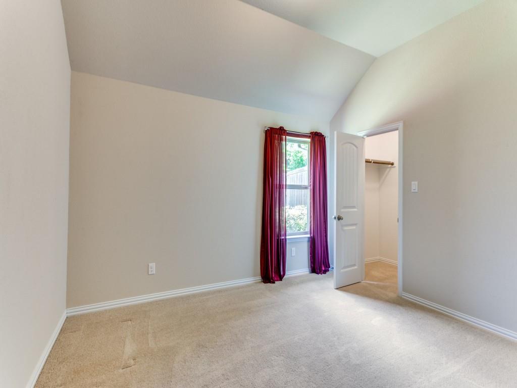 521 Corriente Trail Azle, TX 76020 - Photo 21 of 25 an empty room with a projector and hallway