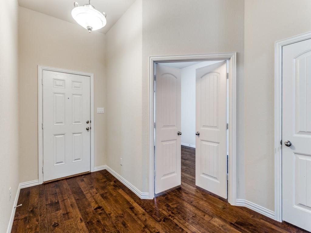 521 Corriente Trail Azle, TX 76020 - Photo 3 of 25 a view of a room with wooden floor and closet