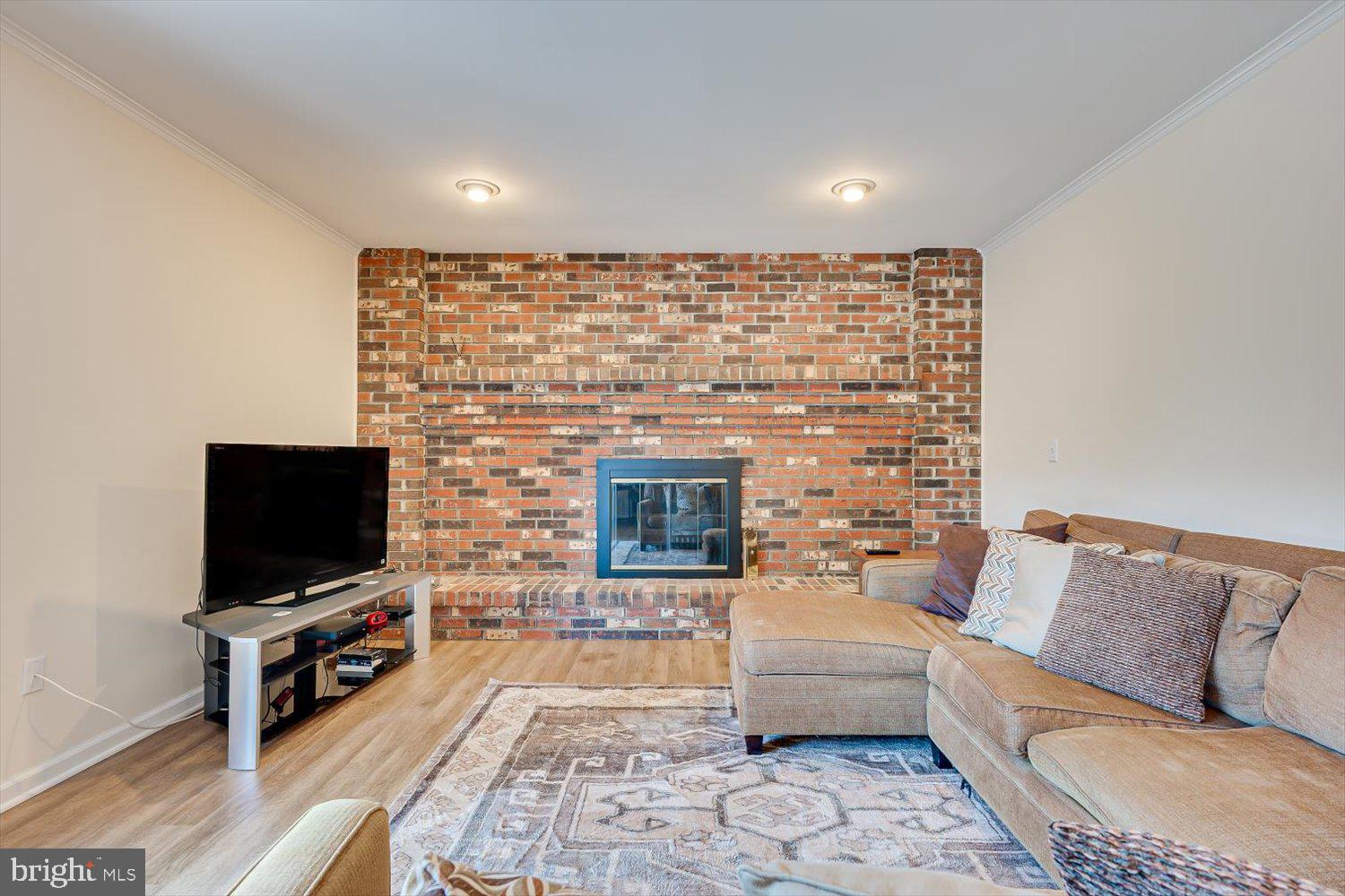 86 Albemarle Road Hamilton, NJ 08690 - Photo 18 of 49 Cozy living space with a brick fireplace.