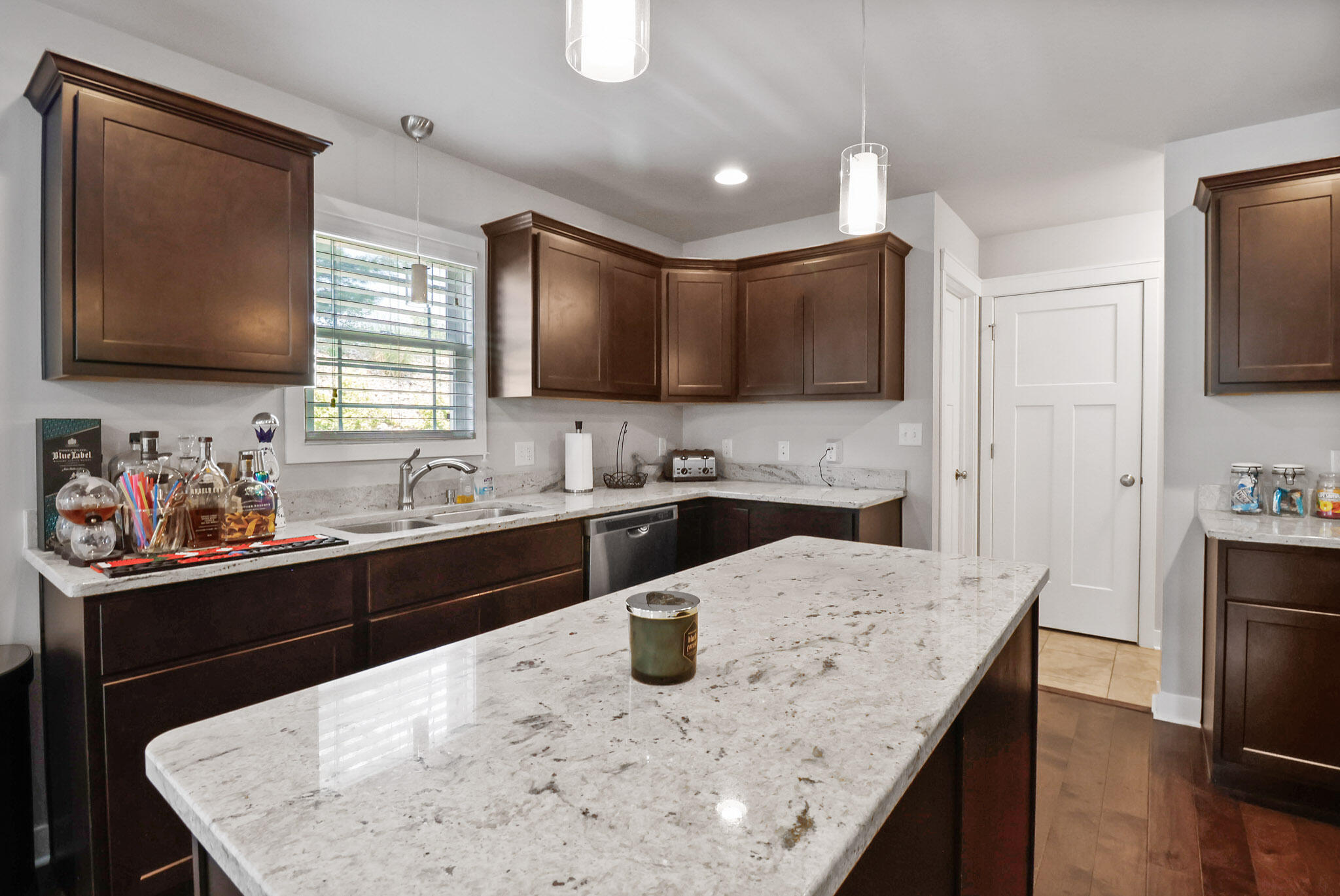 274 Westport Road Valparaiso, IN 46385 - Photo 11 of 28 a kitchen with stainless steel appliances granite countertop a sink a stove and microwave