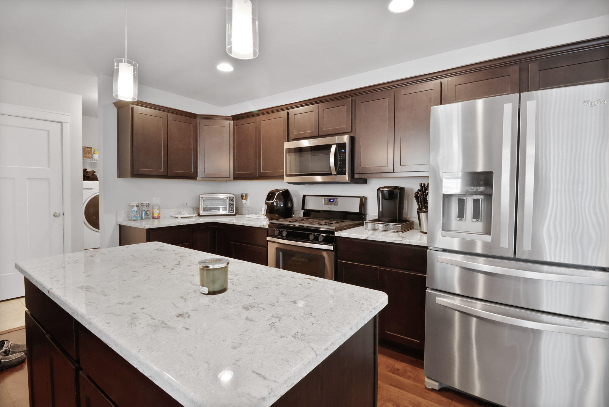 274 Westport Road Valparaiso, IN 46385 - Photo 12 of 28 a kitchen with kitchen island a sink stove and refrigerator