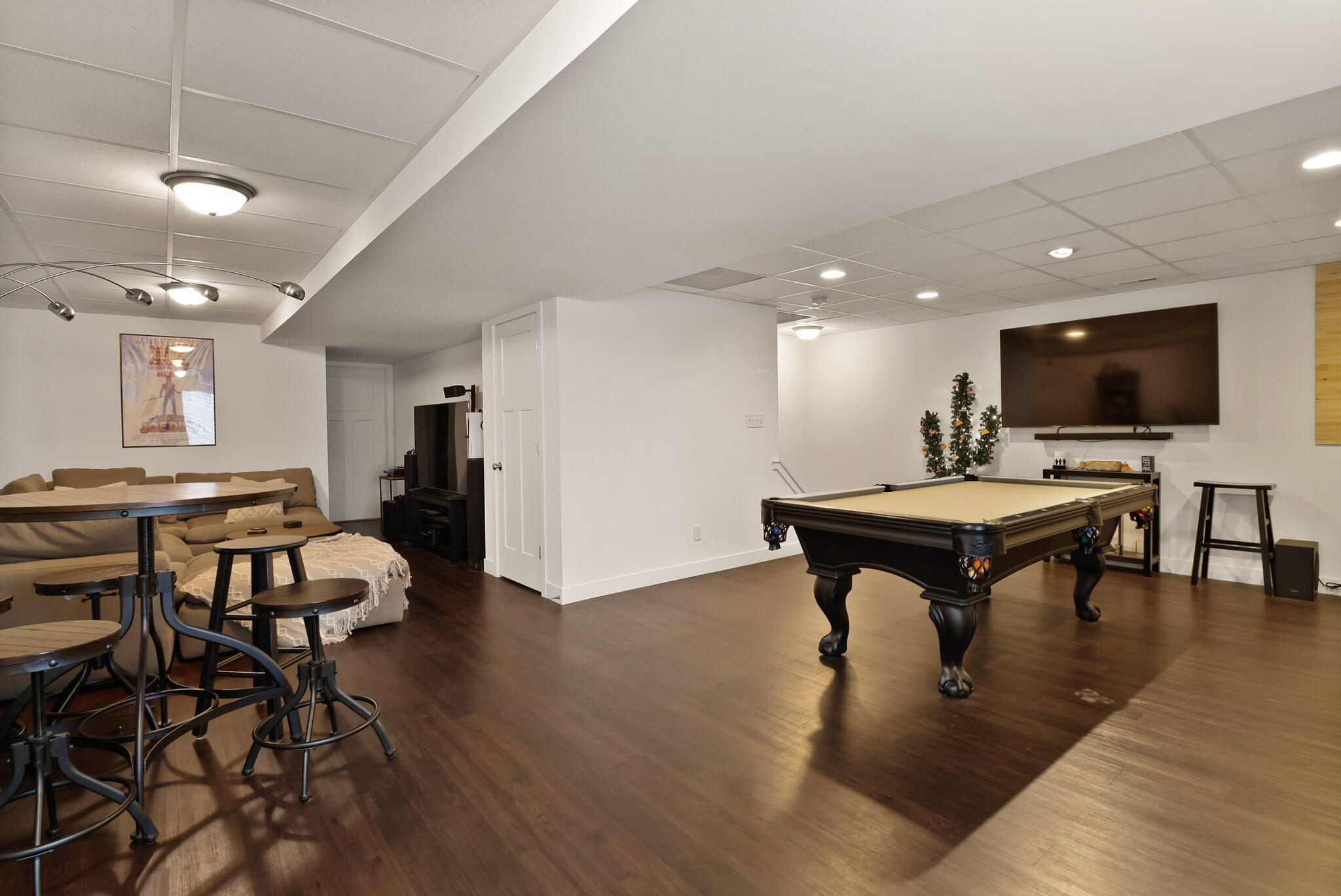 274 Westport Road Valparaiso, IN 46385 - Photo 23 of 28 a living room with furniture a flat screen tv and kitchen view