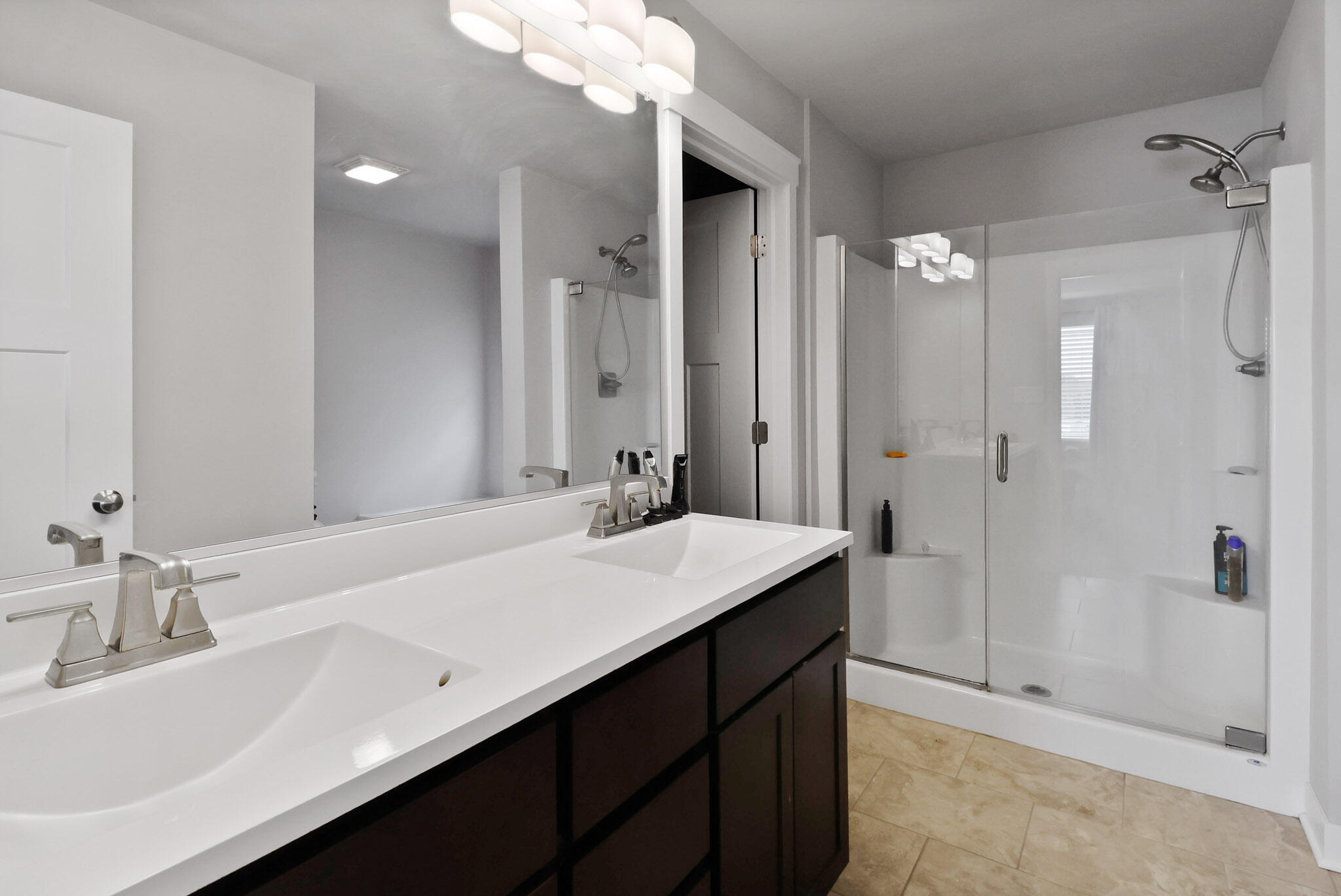 274 Westport Road Valparaiso, IN 46385 - Photo 25 of 28 a bathroom with a sink vanity granite tub and shower