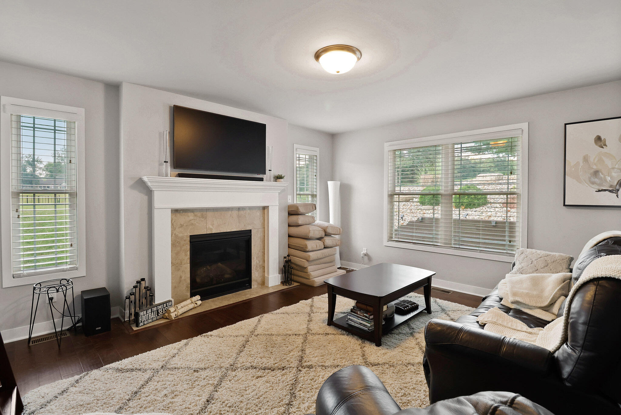 274 Westport Road Valparaiso, IN 46385 - Photo 7 of 28 a living room with furniture a flat screen tv and a fireplace