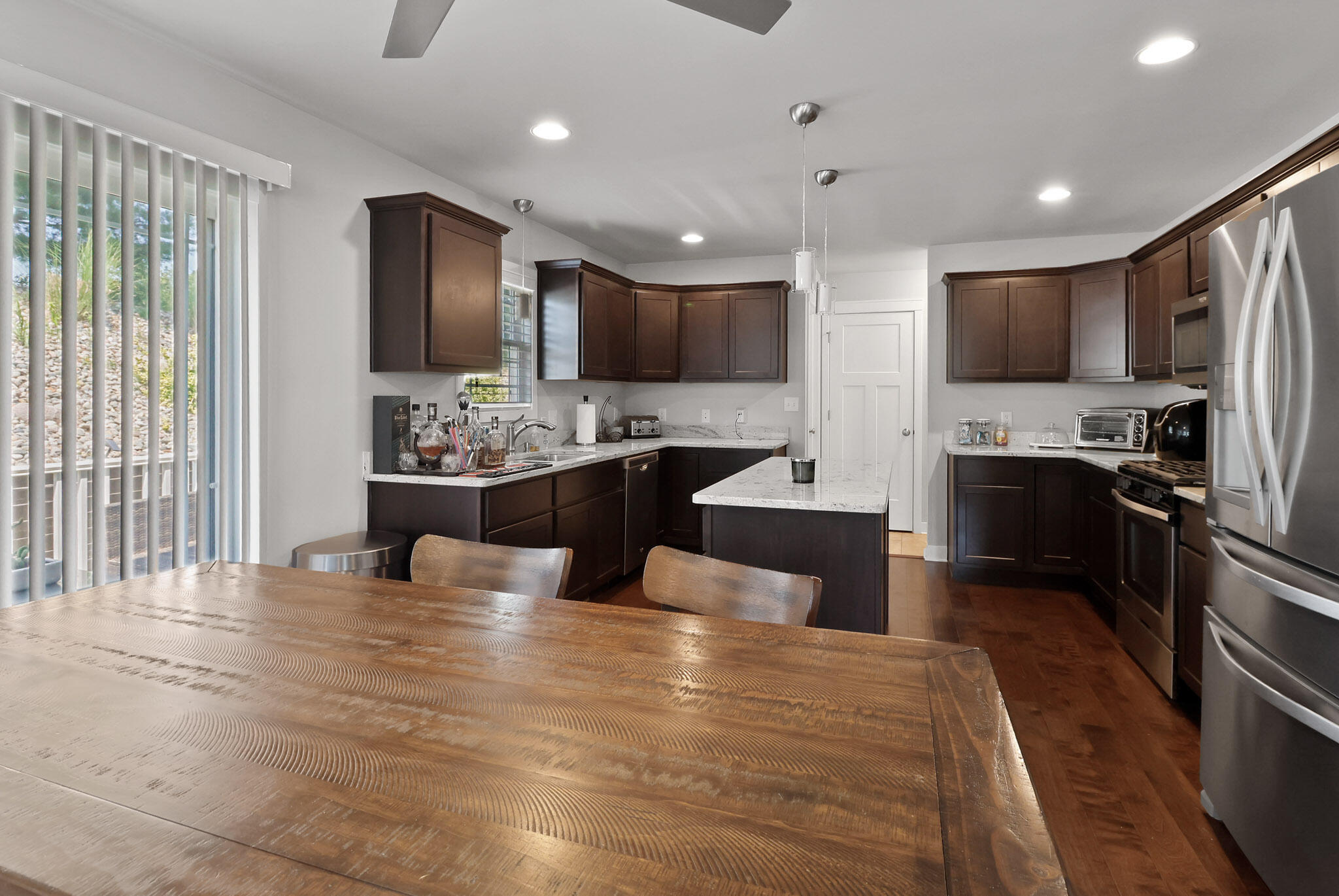 274 Westport Road Valparaiso, IN 46385 - Photo 9 of 28 a large kitchen with kitchen island a sink stainless steel appliances and cabinets