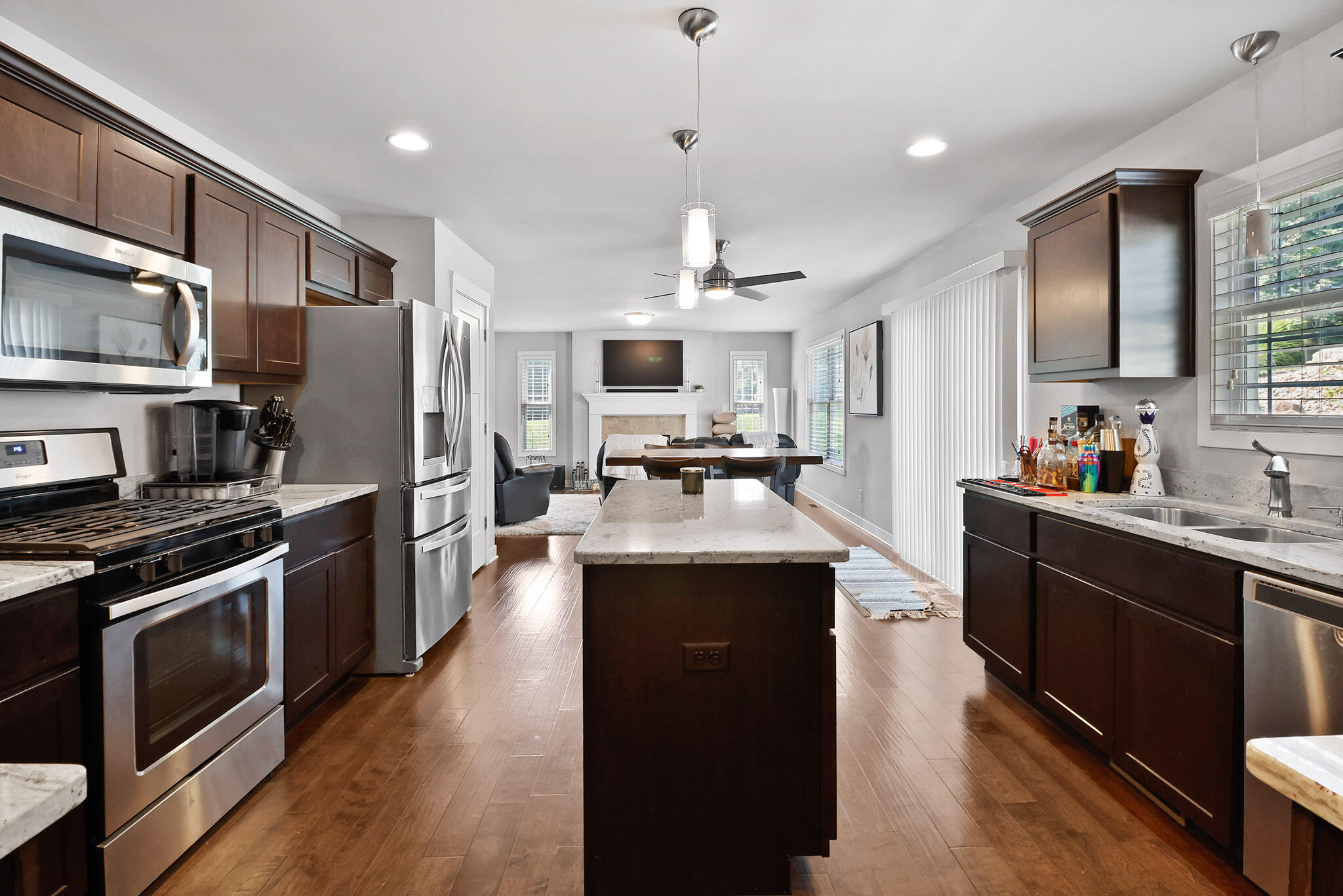 274 Westport Road Valparaiso, IN 46385 - Photo 10 of 28 a kitchen with stainless steel appliances granite countertop a sink stove and refrigerator