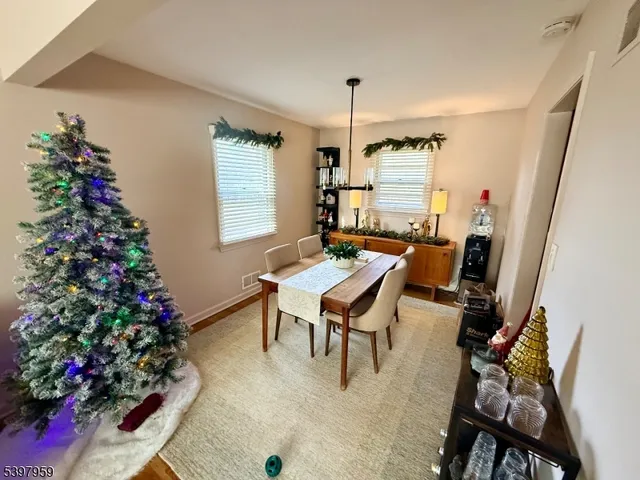a workspace with furniture window and wooden floor