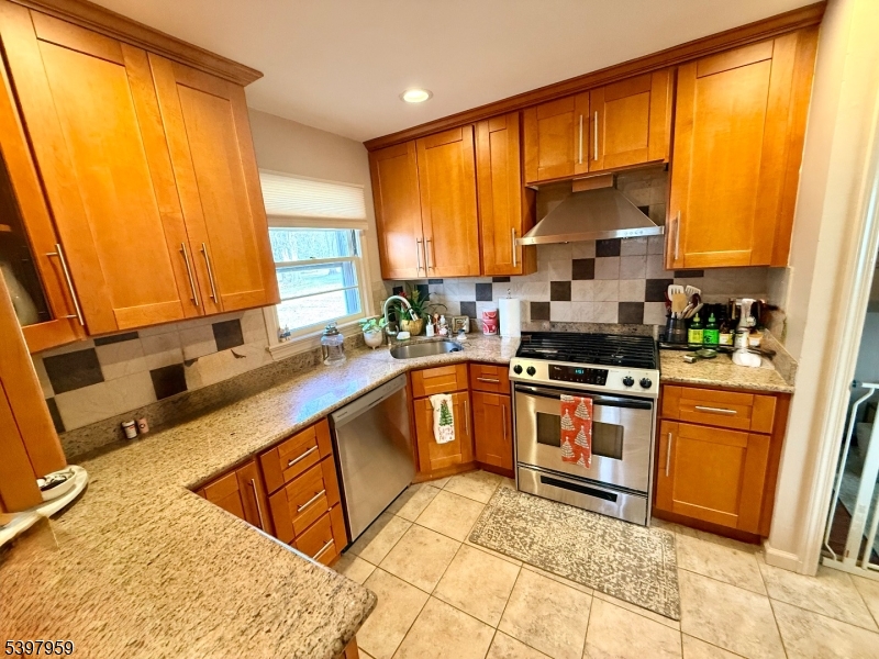 3 Arthur Road Bridgewater, NJ 08807 - Photo 3 of 7 a kitchen with stainless steel appliances granite countertop a sink stove and refrigerator