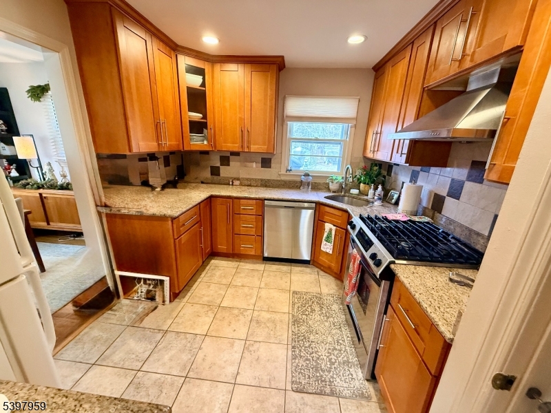 3 Arthur Road Bridgewater, NJ 08807 - Photo 4 of 7 a kitchen with stainless steel appliances granite countertop sink stove and cabinets