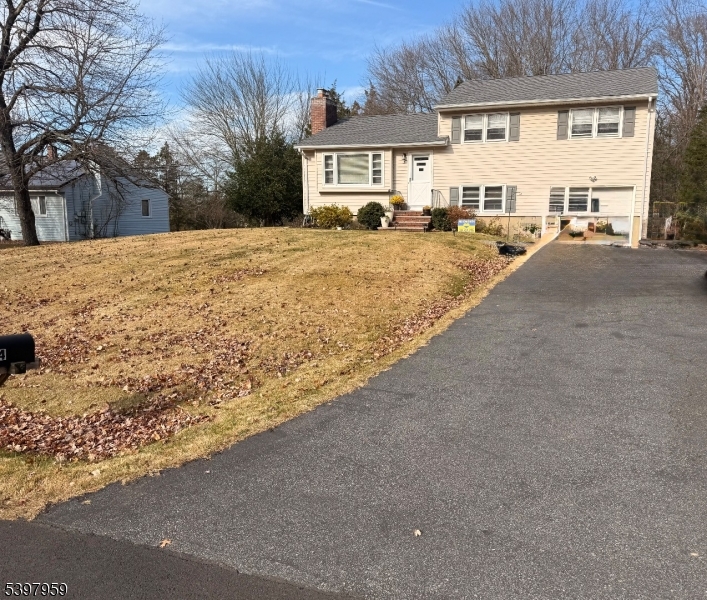 3 Arthur Road Bridgewater, NJ 08807 - Photo 7 of 7 a view of a white house with a yard covered in snow