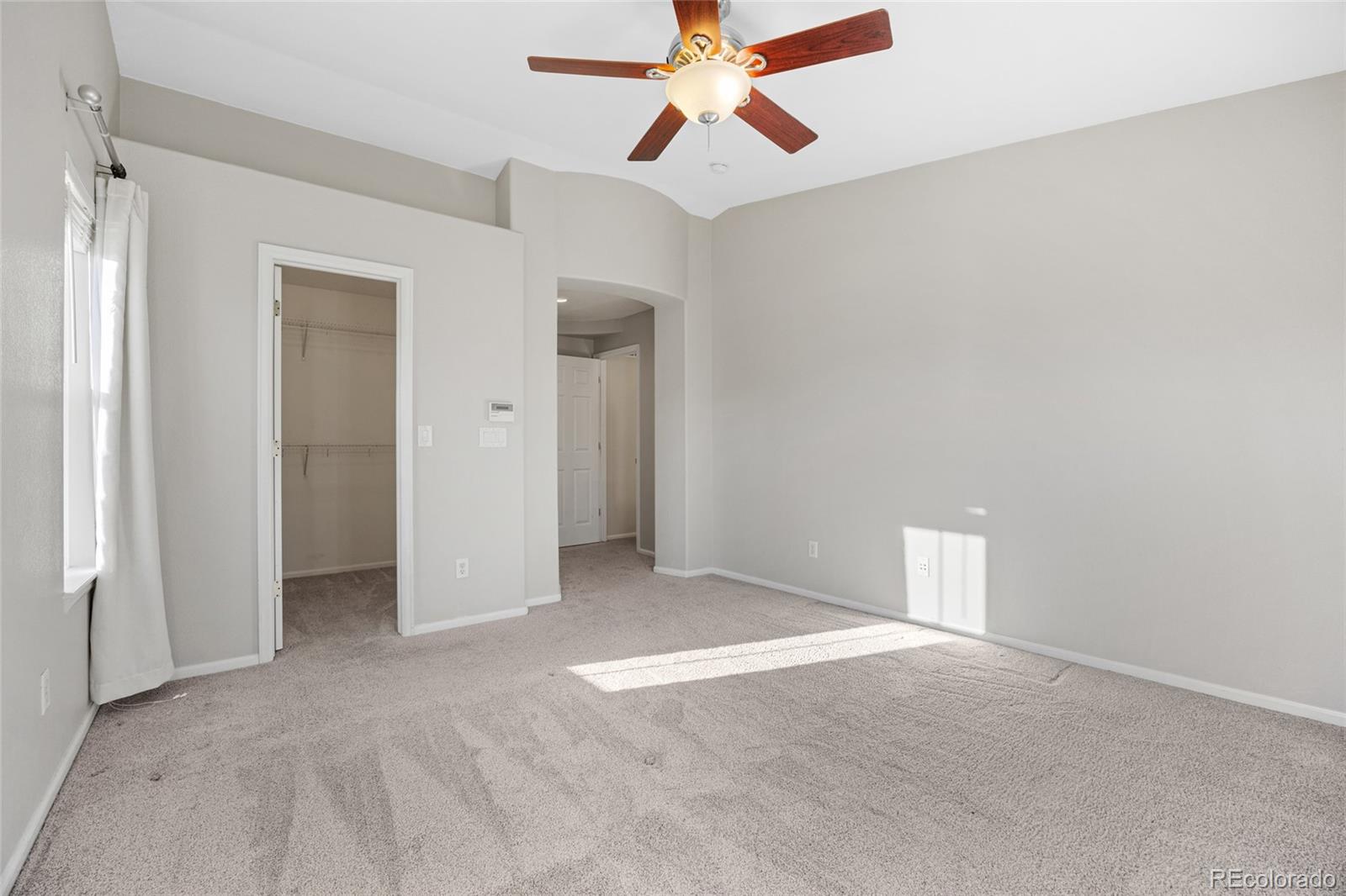 10655 Cherrybrook Circle Highlands Ranch, CO 80126 - Photo 17 of 42 a view of an empty room and chandelier fan
