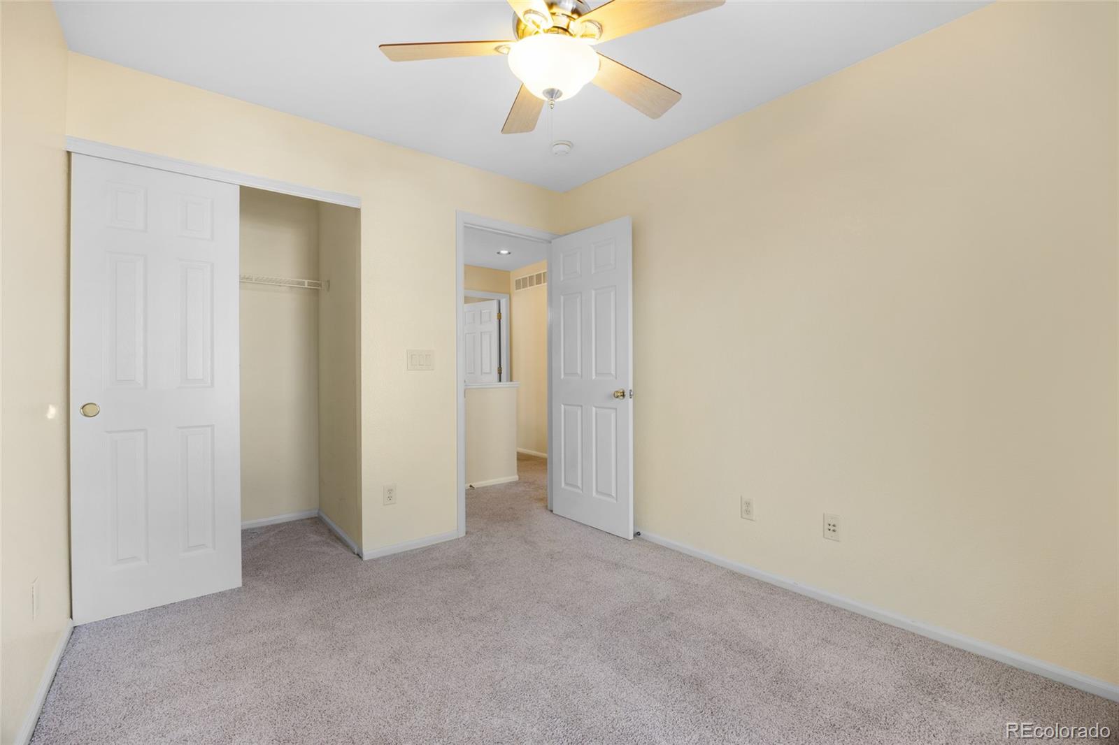 10655 Cherrybrook Circle Highlands Ranch, CO 80126 - Photo 21 of 42 a view of a room with a ceiling fan and a window