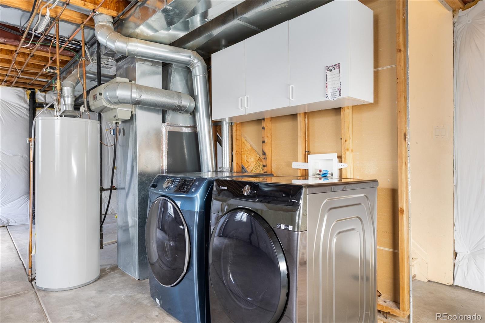 10655 Cherrybrook Circle Highlands Ranch, CO 80126 - Photo 25 of 42 a utility room with dryer and washer
