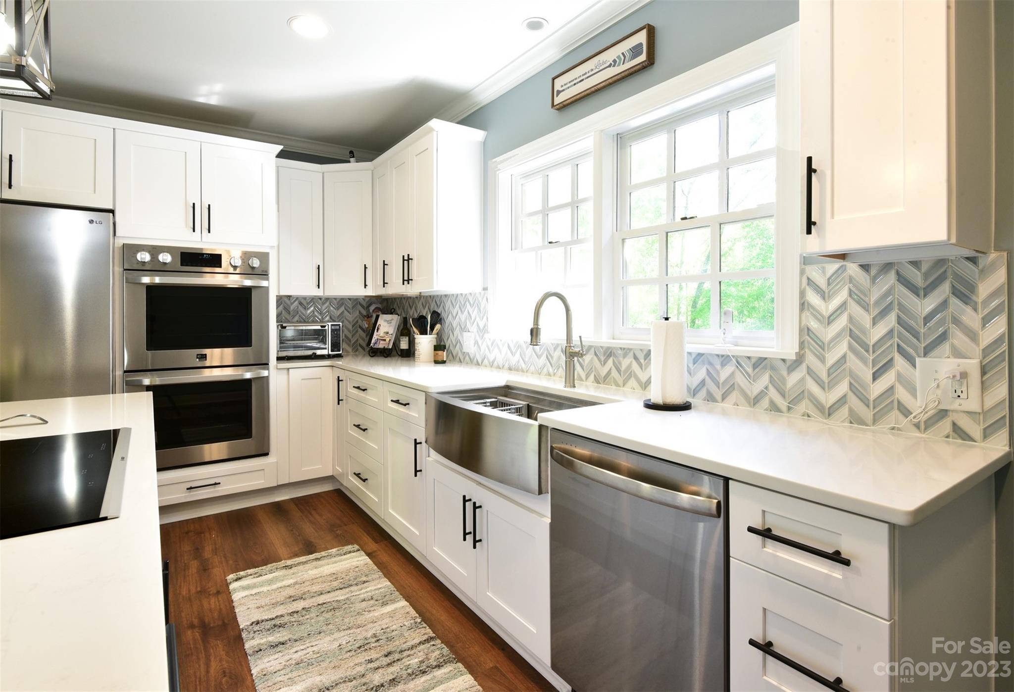 316 Biscoe Road Troy, NC 27371 - Photo 11 of 39 a kitchen with a sink stove and microwave