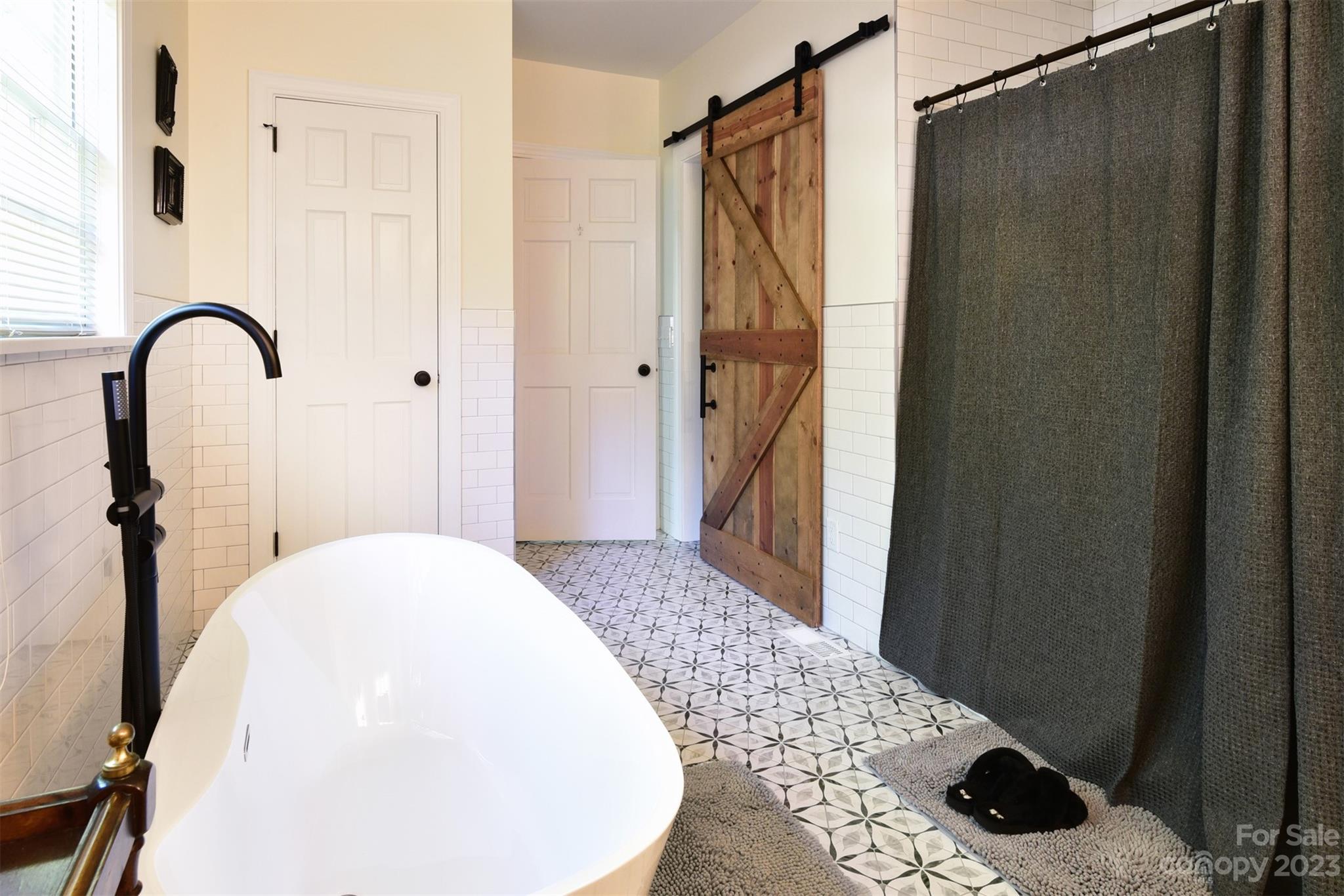 316 Biscoe Road Troy, NC 27371 - Photo 16 of 39 a bathroom with a sink and a shower