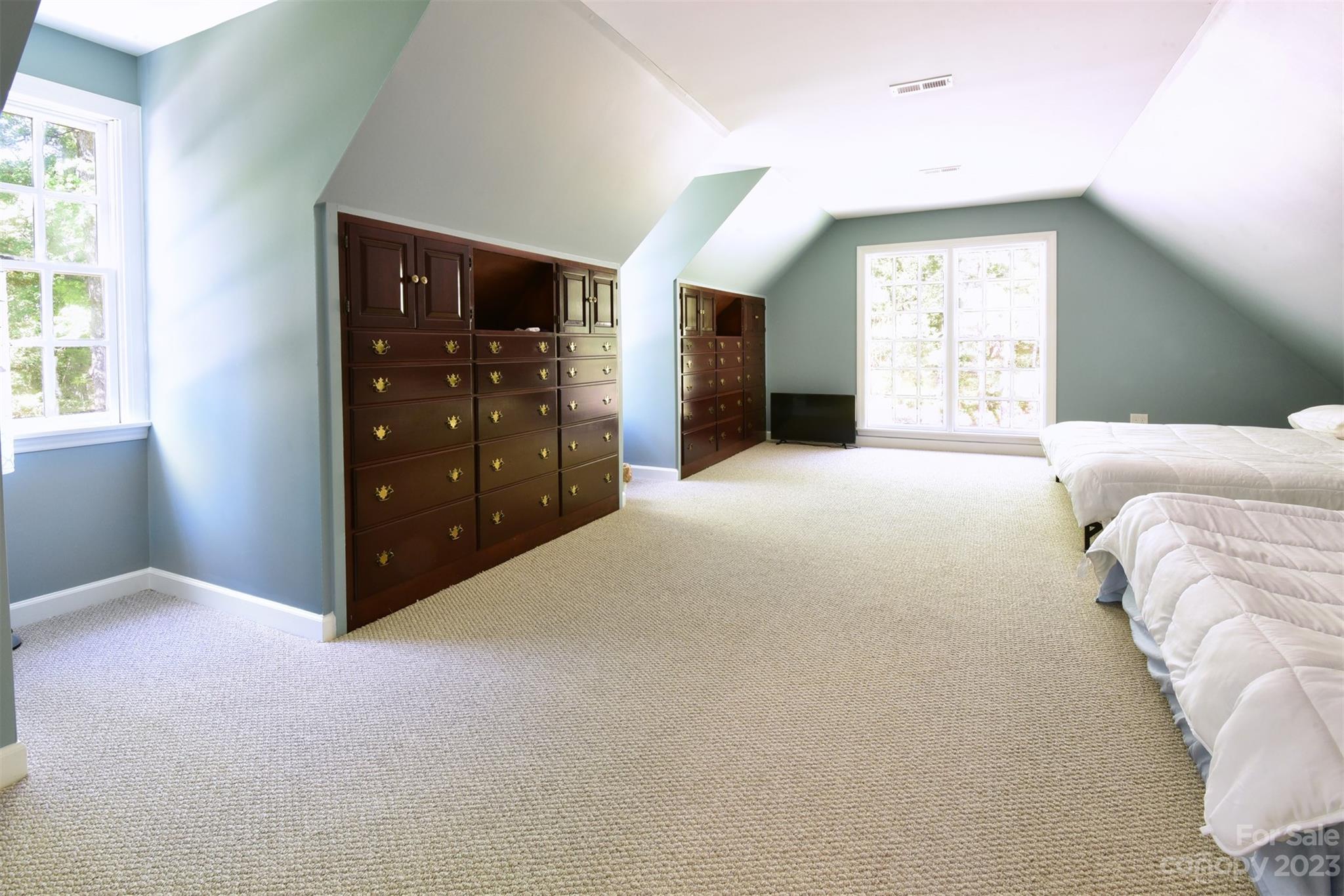 316 Biscoe Road Troy, NC 27371 - Photo 22 of 39 a living room with a bed and a window