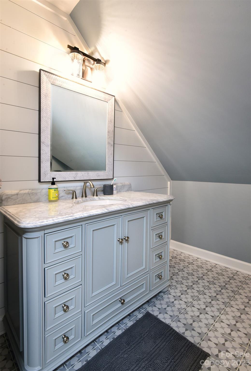 316 Biscoe Road Troy, NC 27371 - Photo 29 of 39 a bathroom with a sink double vanity and a mirror