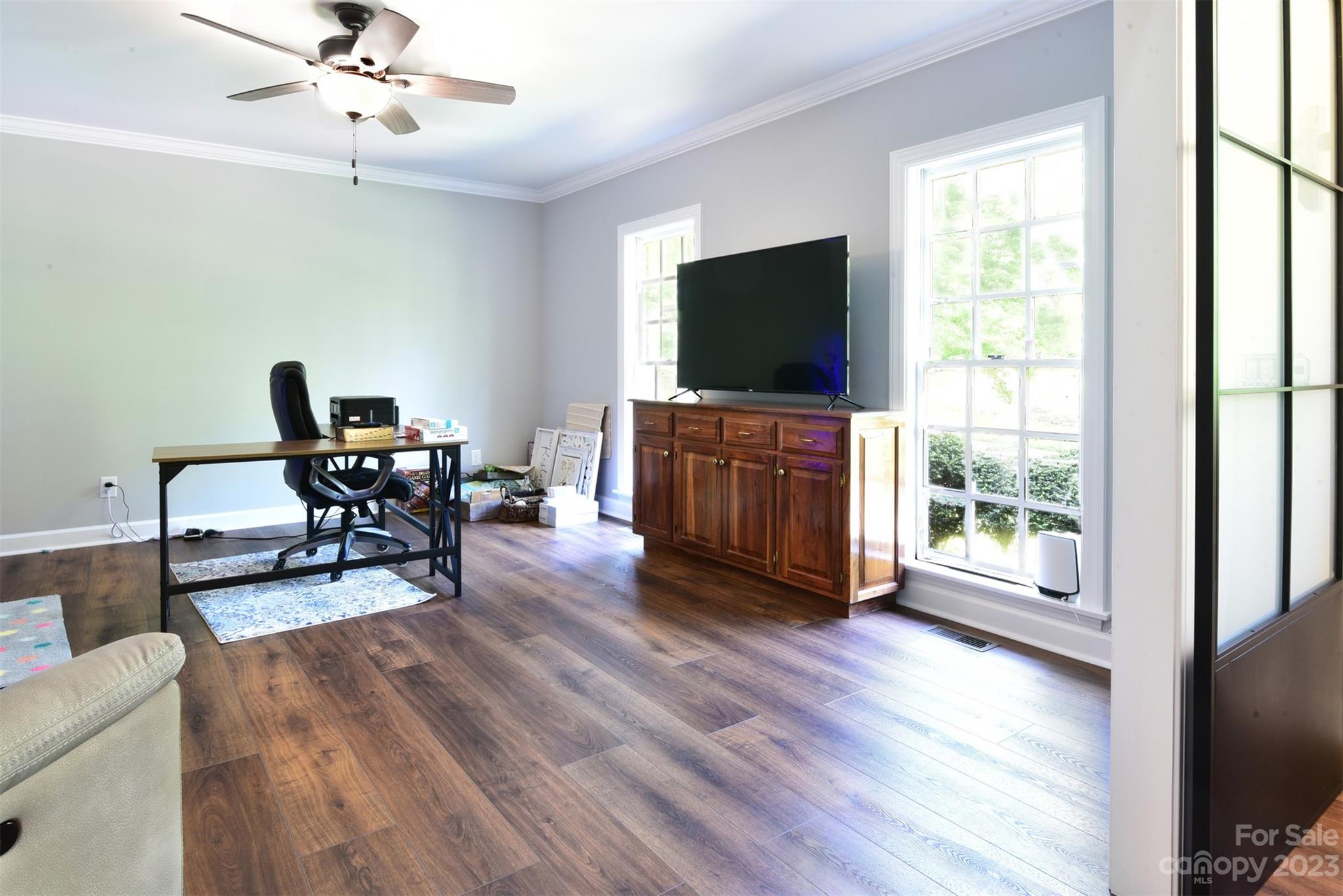 316 Biscoe Road Troy, NC 27371 - Photo 4 of 39 a living room with furniture and a flat screen tv