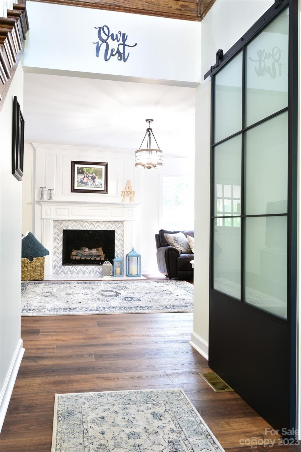 316 Biscoe Road Troy, NC 27371 - Photo 5 of 39 a living room with furniture wooden floor and a fireplace
