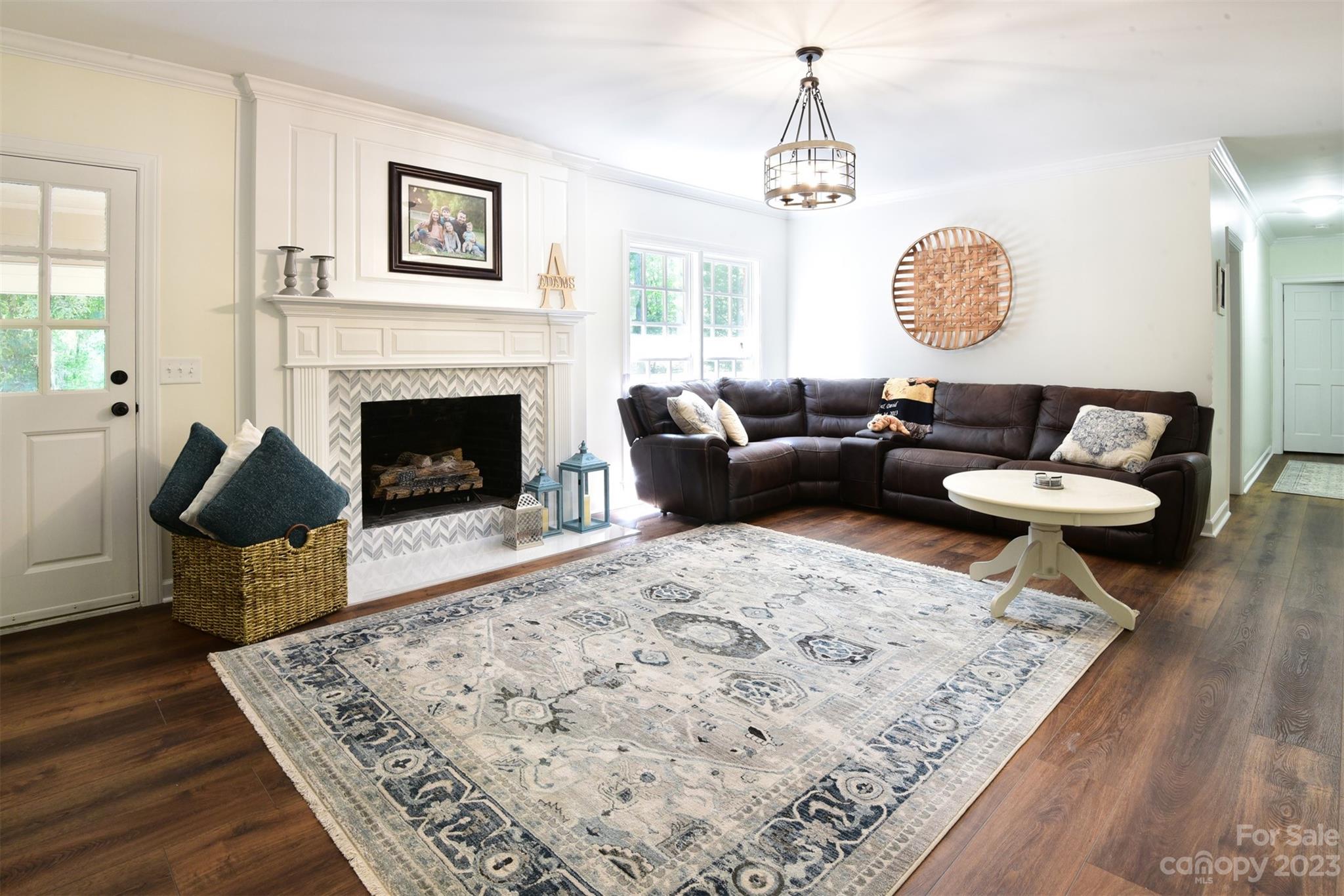316 Biscoe Road Troy, NC 27371 - Photo 6 of 39 a living room with furniture and a fireplace