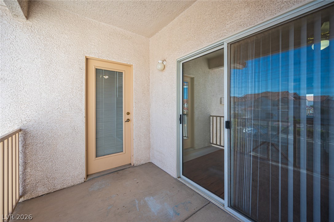 8555 West Russell Road, Unit 2062 Las Vegas, NV 89113 - Photo 27 of 35 A quiet private balcony extends the living space outdoors with seamless transitions.
