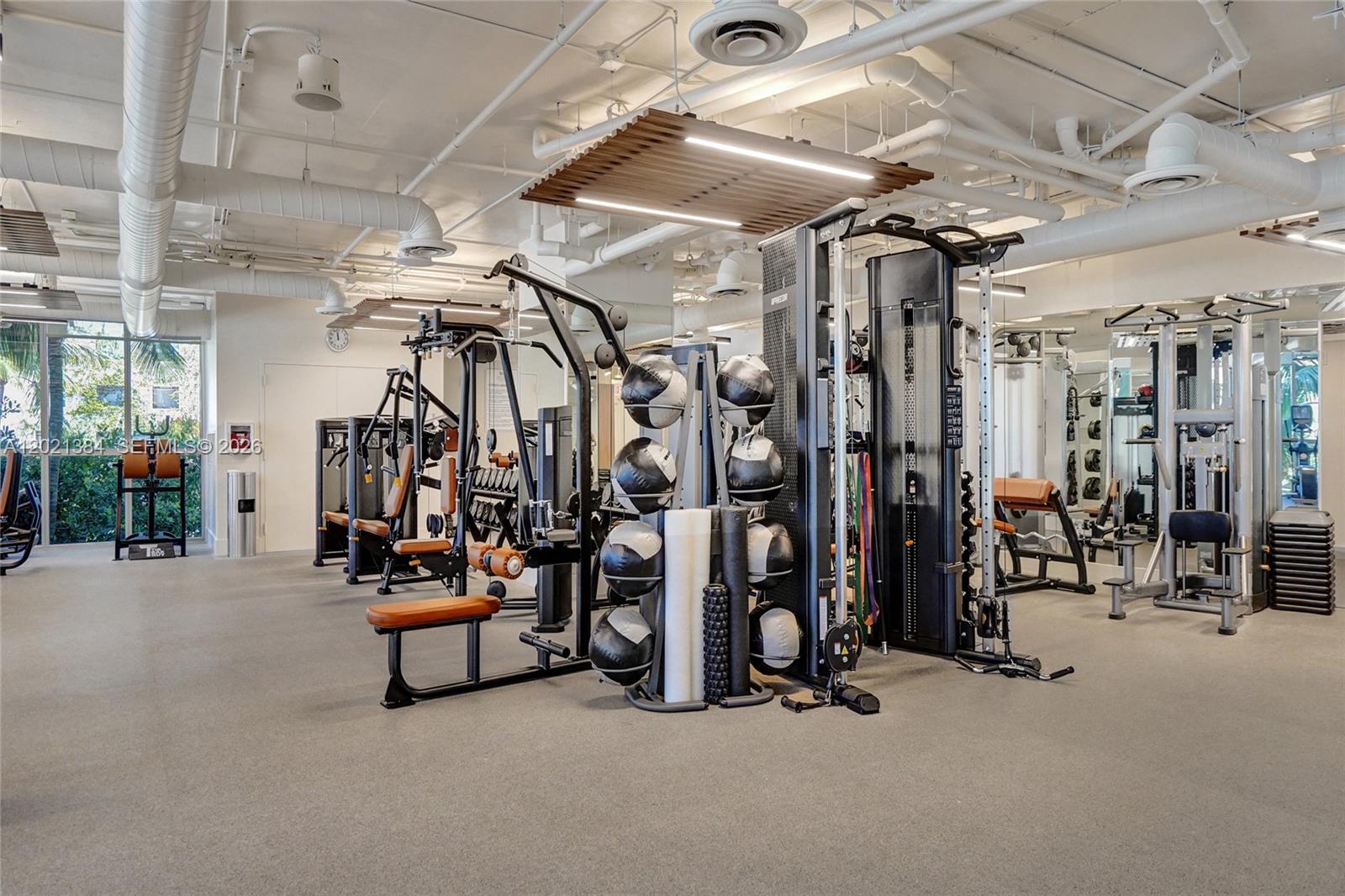 400 Alton Road, Unit PH11 Miami Beach, FL 33139 - Photo 43 of 49 a view of a room with gym equipment