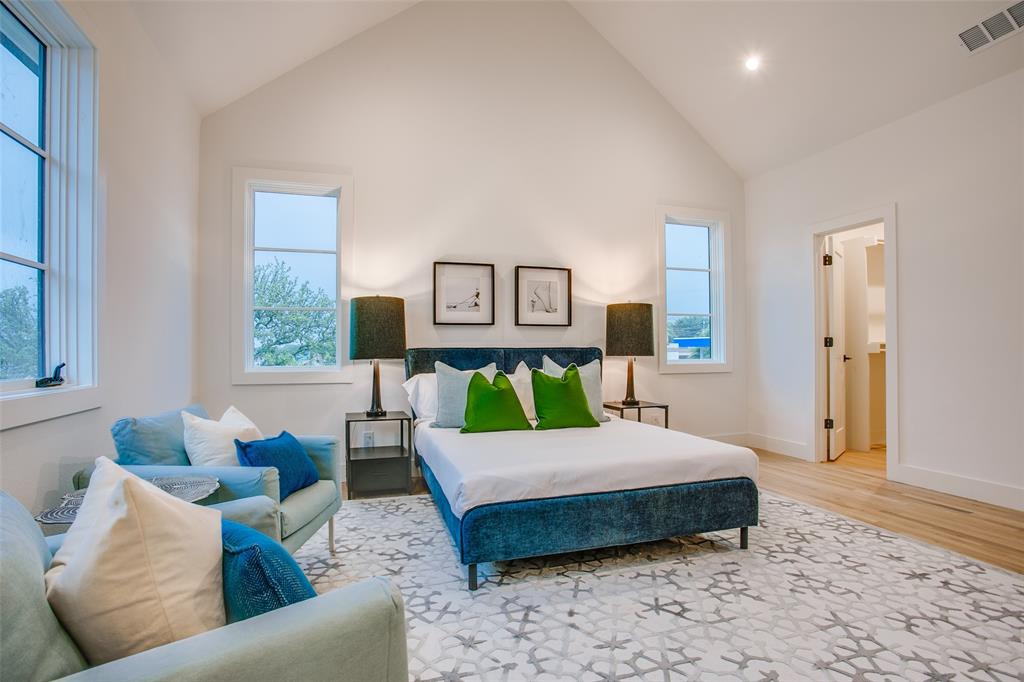 7207 Gaston Avenue, Unit 906 Dallas, TX 75214 - Photo 22 of 34 a bedroom with a bed couch and window