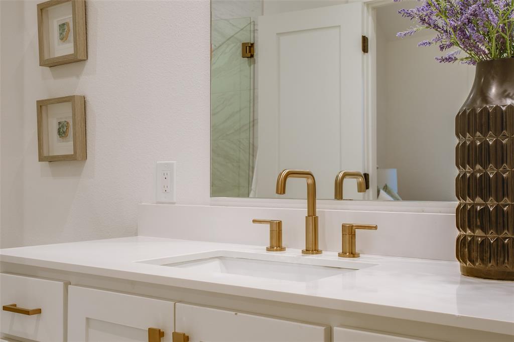 7207 Gaston Avenue, Unit 906 Dallas, TX 75214 - Photo 34 of 34 a bathroom with a sink and a mirror