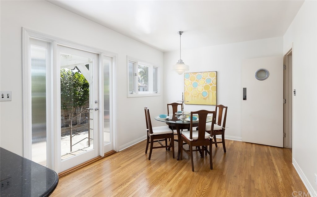 910 East Maple Avenue Orange, CA 92866 - Photo 14 of 38 a view of a dining room with furniture window and wooden floor