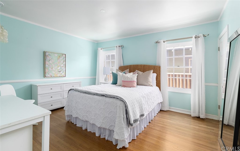 910 East Maple Avenue Orange, CA 92866 - Photo 15 of 38 a bedroom with a bed and a window