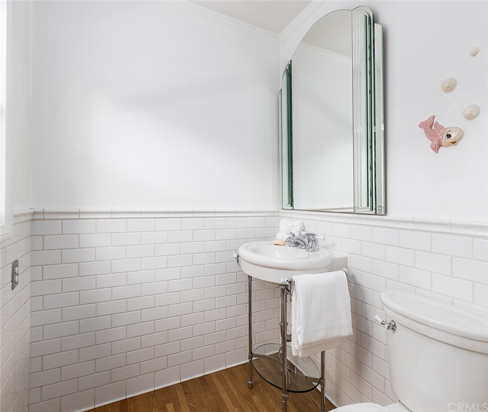 910 East Maple Avenue Orange, CA 92866 - Photo 16 of 38 a bathroom with a sink and a mirror