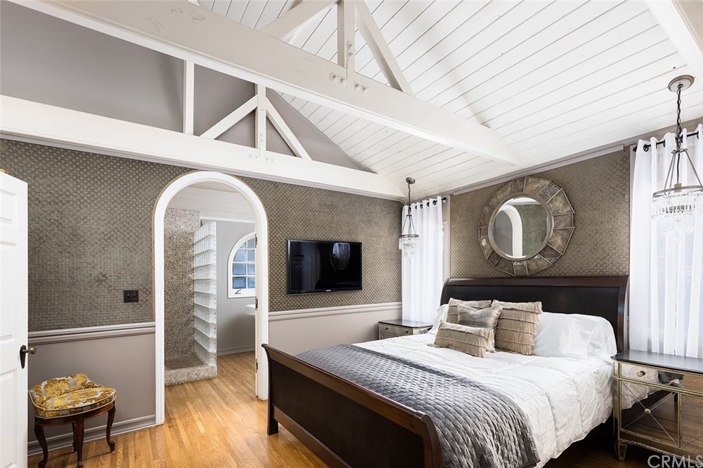 910 East Maple Avenue Orange, CA 92866 - Photo 20 of 38 a bedroom with a bed and glass wall