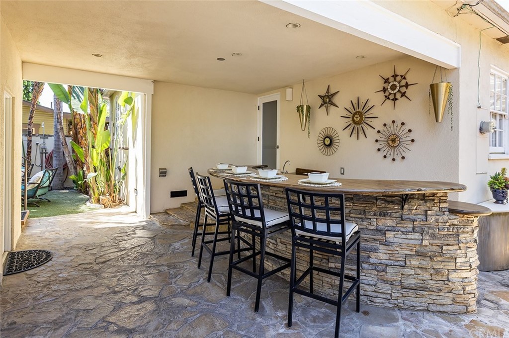 910 East Maple Avenue Orange, CA 92866 - Photo 25 of 38 a view of a dining room with furniture and a floor to ceiling window