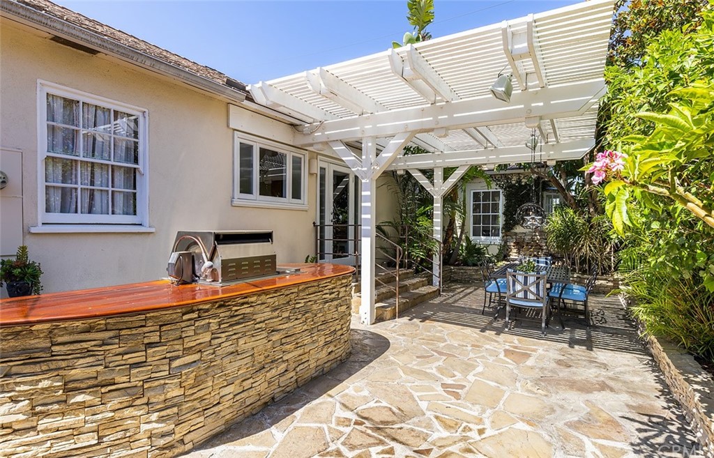 910 East Maple Avenue Orange, CA 92866 - Photo 26 of 38 a front view of a house with outdoor seating